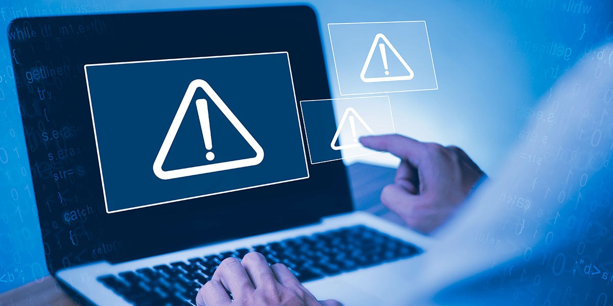 Cyber security concept. Man using computer with system hacked alert due to cyber attack on computer network. Data Protection. Internet virus cyber security and cybercrime